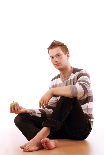 Young man sitting on the floor — Stock Photo, Image