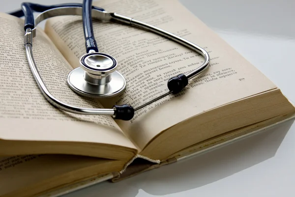 Stethoscope on a book — Stock Photo, Image