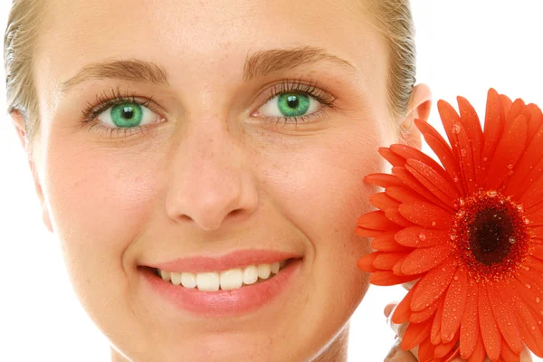 Cara femenina con una flor —  Fotos de Stock
