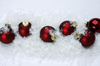 Christmas balls on snow.