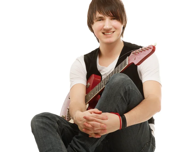 A handsome man playing a guitar — Stock Photo, Image