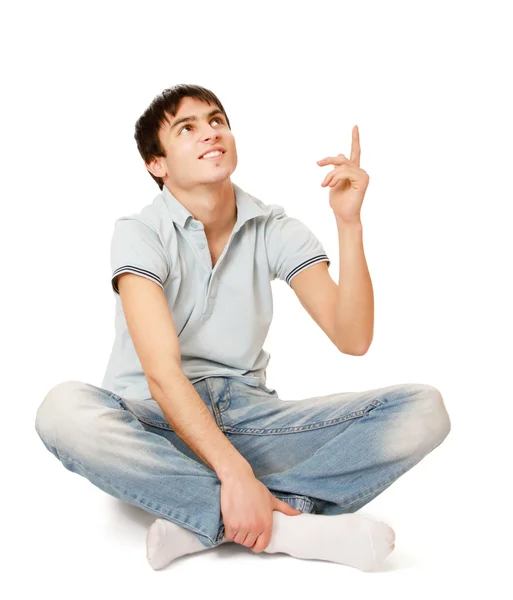 Young man sitting on floor — Stock Photo, Image