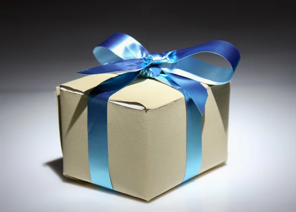 Gift box with blue tape — Stock Photo, Image