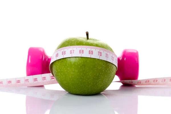 Apple, dumbbell, tape — Stock Photo, Image