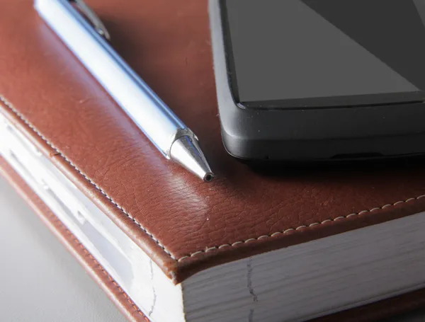 Notebook and phone. — Stock Photo, Image