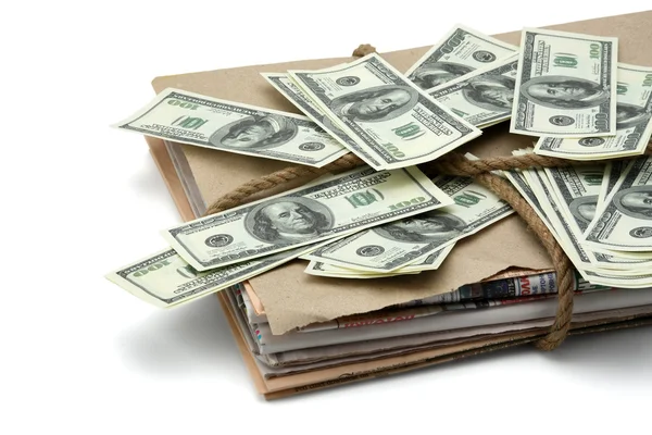 Newspaper stack and dollars. — Stock Photo, Image