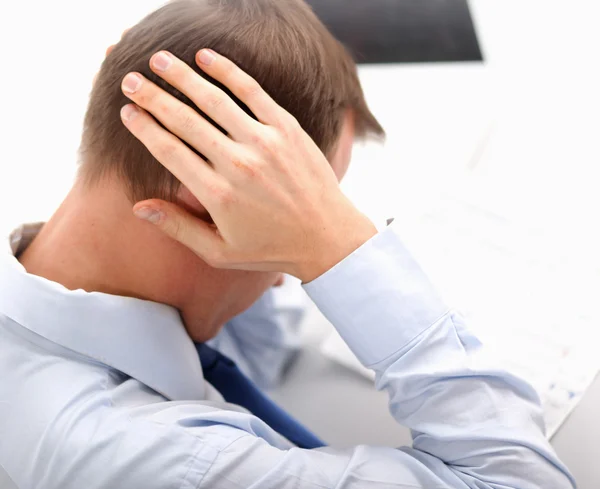 En affärsman med huvudvärk — Stockfoto