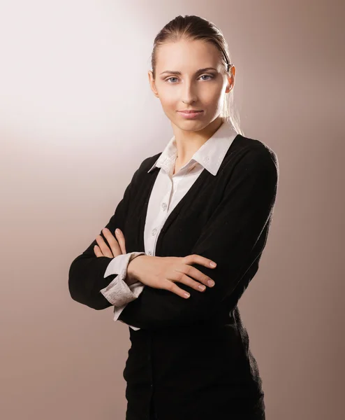 Businesswoman standing with folded arms Royalty Free Stock Photos