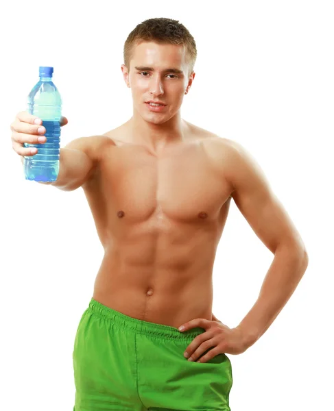 Man drinking water after workout in the gym. Stock Image