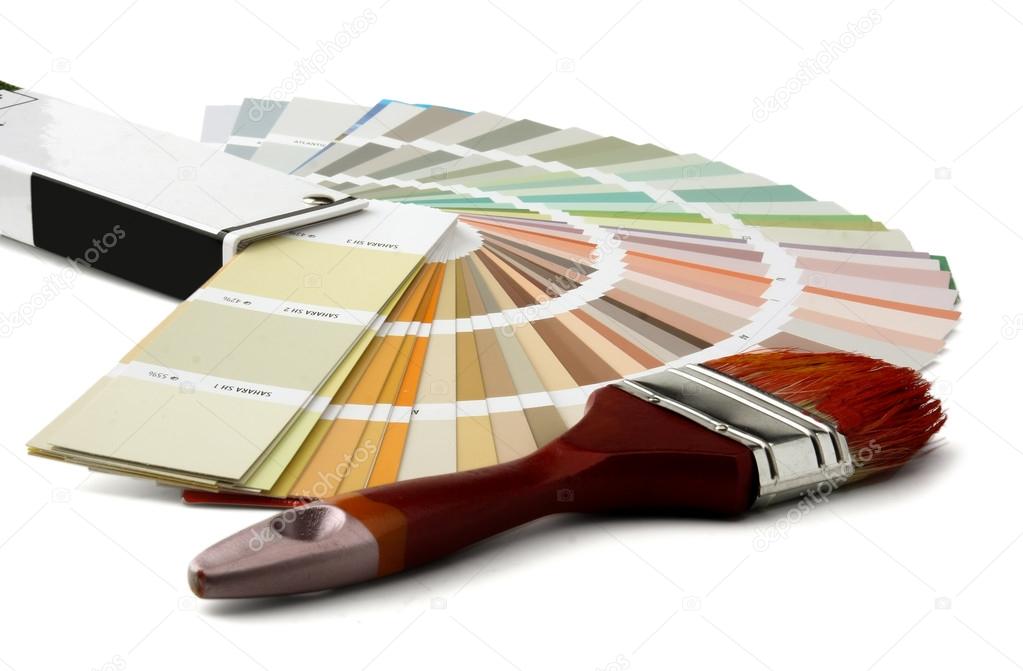 Close-up of a color palette and a brush