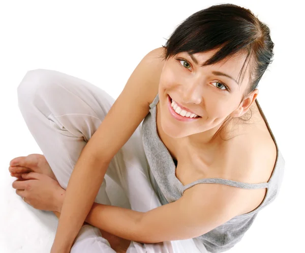 Young woman sitting on the floor — Stock Photo, Image