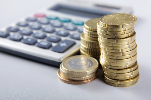 Coins and calculator. — Stock Photo, Image