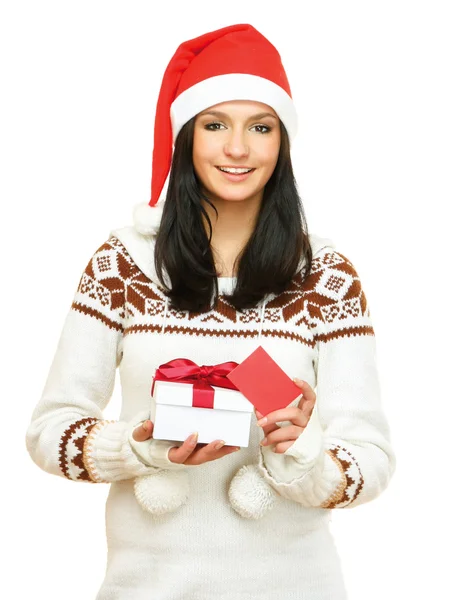 与礼物的圣诞老人帽子的女人 — 图库照片