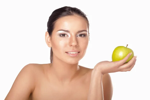 Young woman with a green apple Stock Picture