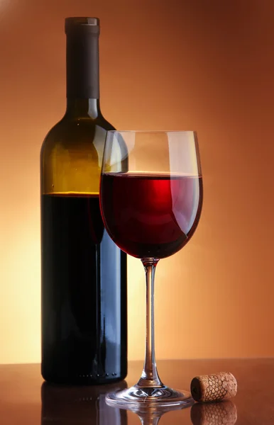 Glass of wine and a bottle — Stock Photo, Image