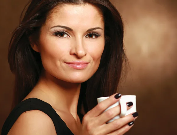 Woman with  coffee in hands — Stock Photo, Image