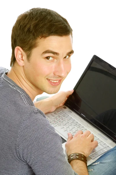 Guy sitting on the floor with a laptop — Stock Photo, Image