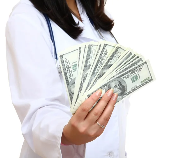 Dollars in the hands of a female doctor — Stock Photo, Image
