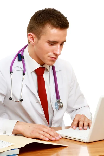 Male doctor working at desk — Stock Photo, Image