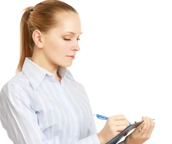 Frau macht sich Notizen in einem Ordner — Stockfoto