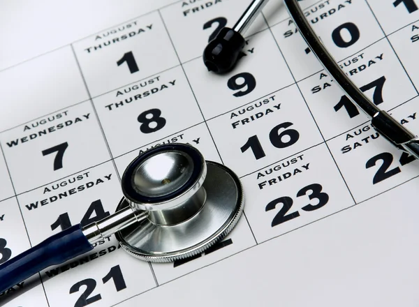 Stethoscope on calendar — Stock Photo, Image