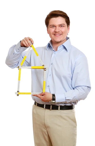 Man holding a symbol of house — Stock Photo, Image