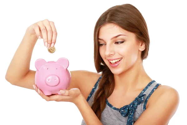 Woman standing with piggy bank — Stock Photo, Image