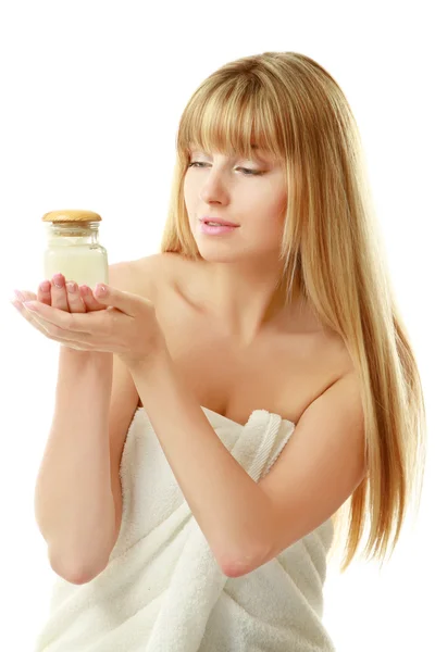Woman holding a bottle of cream — Stock Photo, Image