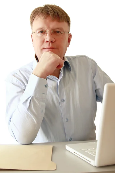 Man sitting in front of a laptop — Stock Photo, Image