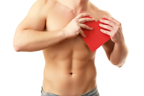 Young strong man with a red heart — Stock Photo, Image