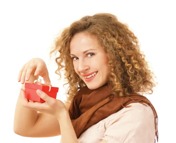 Woman holding gift with ribbon — Stock Photo, Image