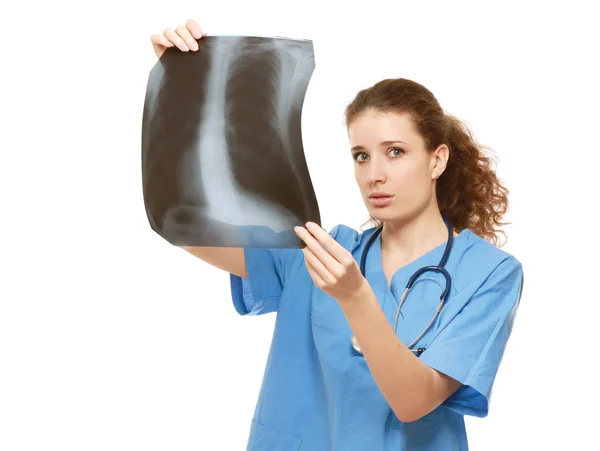 Female doctor examining an X-ray picture — Stock Photo, Image