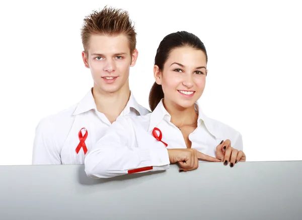 Couple using red for AIDS, holding blank — Stockfoto