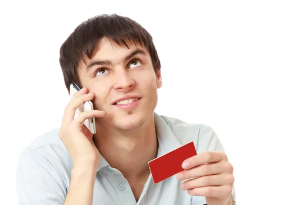 Hombre con teléfono móvil y tarjeta —  Fotos de Stock