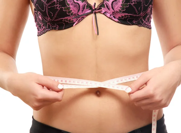 Woman measure her waist belly by metre-stick.. — Stock Photo, Image