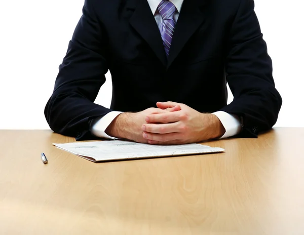 Unknown businessman sitting on the desk — Stock Photo, Image