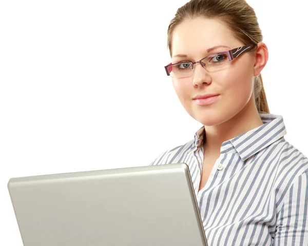 Woman wearing glasses in front of a laptop — Stock Photo, Image