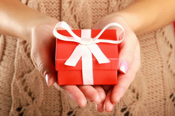 Female hand holding gift box Royalty Free Stock Photos