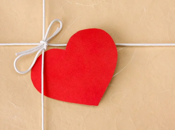 Red heart on a gift box. — Stock Photo, Image