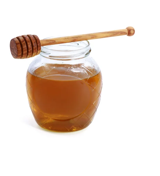 Honey and honey spoon. — Stock Photo, Image