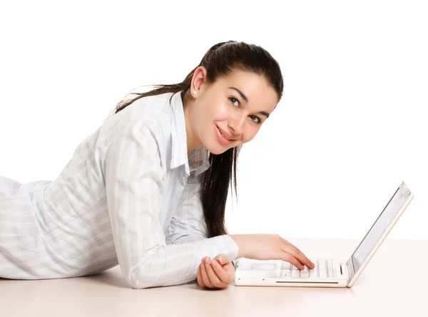 Businesswoman lying on the floor with laptop. — Stock Photo, Image