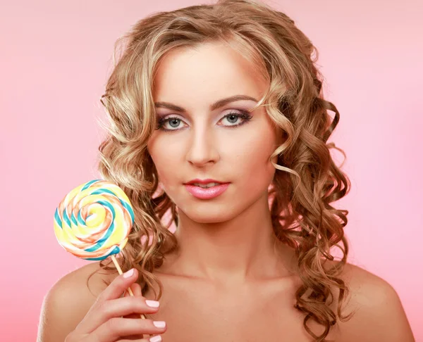 Young happy woman with lollipop — Stock Photo, Image