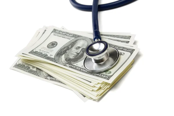 Heap of dollars with stethoscope — Stock Photo, Image