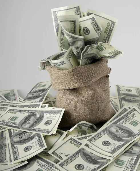 Canvas money sack with one hundred dollar bills — Stock Photo, Image