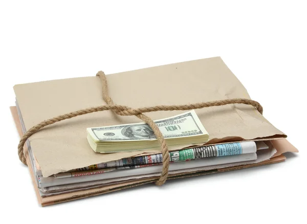 A newspaper stack and dollars — Stock Photo, Image