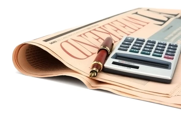 Newspaper and calculator. — Stock Photo, Image