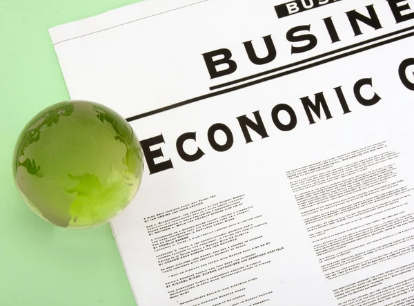 Globe and newspaper. — Stock Photo, Image