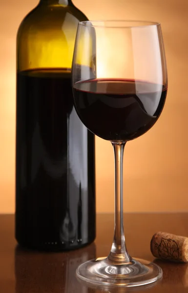Glass of wine and a bottle. — Stock Photo, Image
