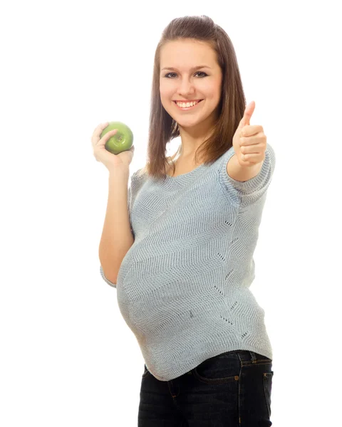 Femme enceinte avec pomme et montrant ok — Photo