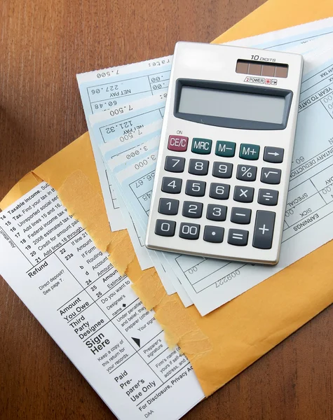 Calculator on business paper — Stock Photo, Image